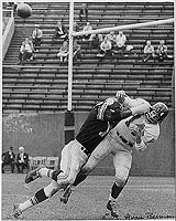 John Baker smashes Y.A. Tittle.